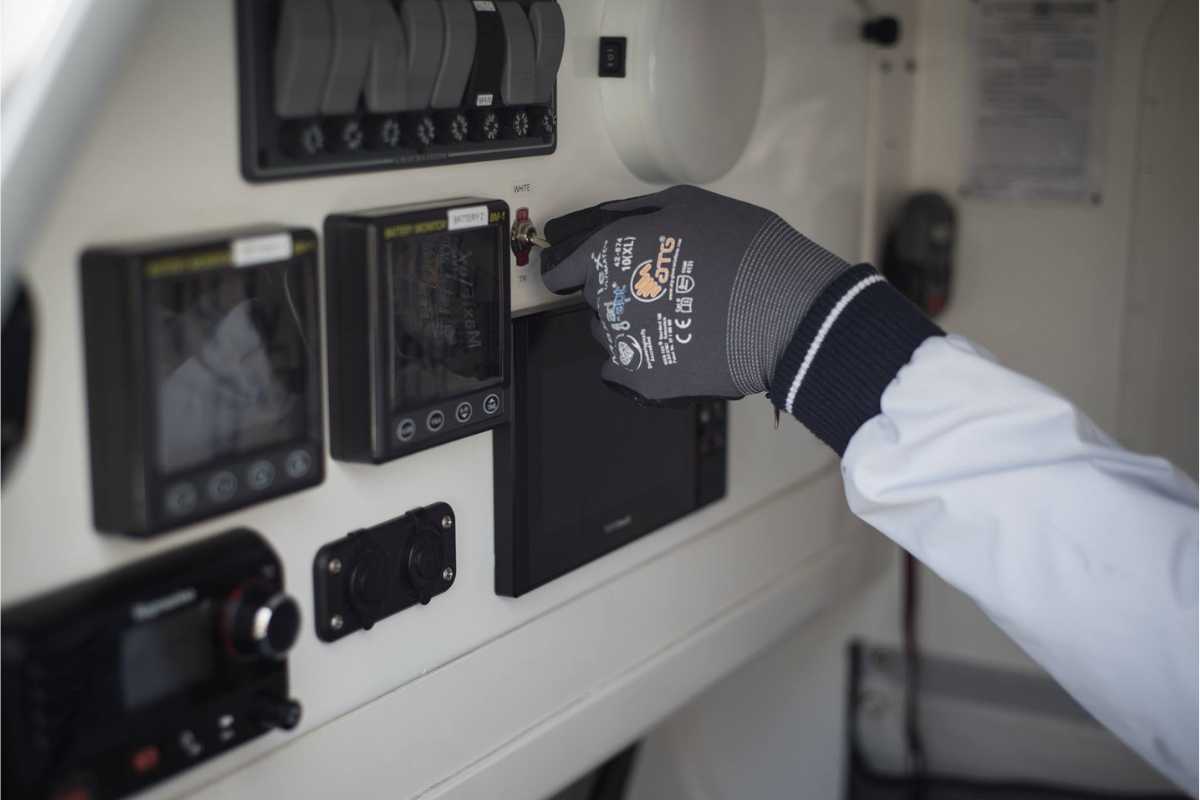 ATG gloves at work on a sailboat